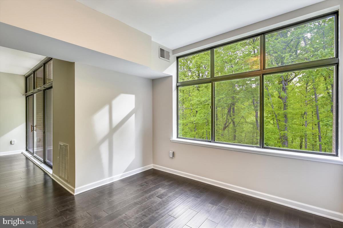 11564 Rolling Green Court, Unit 201 Reston, VA 20191 - Photo 13 of 29 Tranquil Wooded View from Dining Room