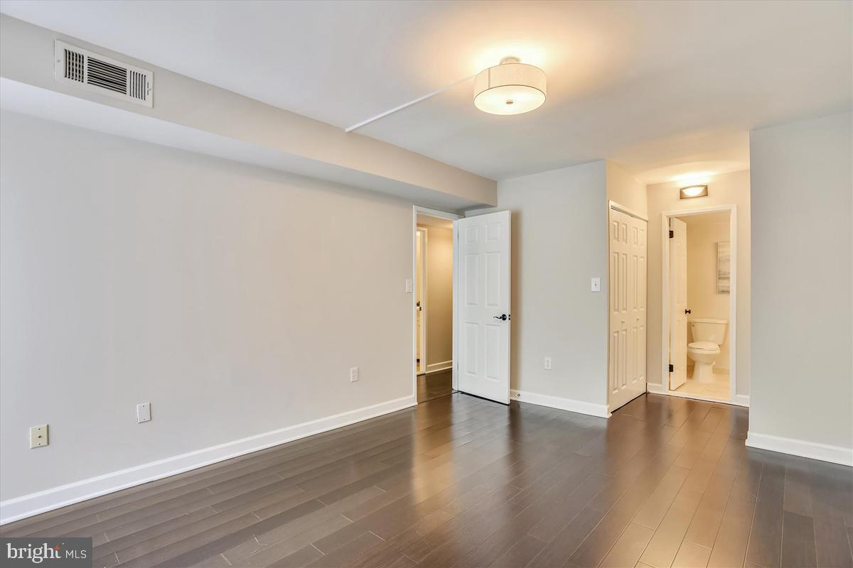 11564 Rolling Green Court, Unit 201 Reston, VA 20191 - Photo 17 of 29 Spacious Master Bedroom w/ 2 Closets & Master Bath