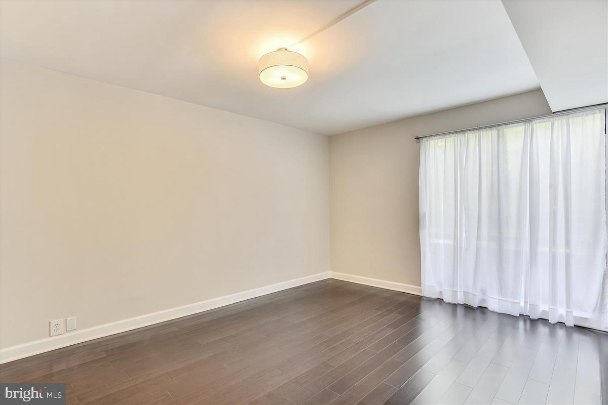 11564 Rolling Green Court, Unit 201 Reston, VA 20191 - Photo 18 of 29 Master Bedroom w/ Wide-Plank Flooring