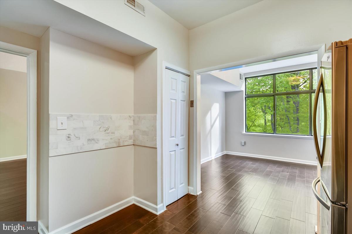 11564 Rolling Green Court, Unit 201 Reston, VA 20191 - Photo 5 of 29 Pantry Closet, 2 Openings to Living Rm & Dining Rm
