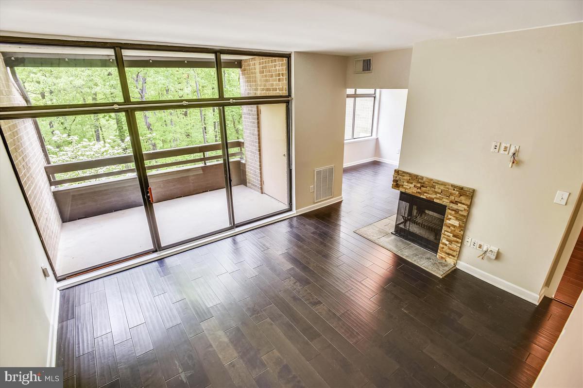 11564 Rolling Green Court, Unit 201 Reston, VA 20191 - Photo 6 of 29 High Ceiling, Wood-Burning Fireplace & Balcony