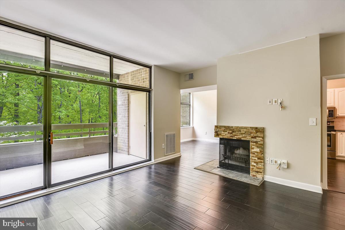 11564 Rolling Green Court, Unit 201 Reston, VA 20191 - Photo 8 of 29 Wide-Plank Flooring in LR, DR & Kitchen