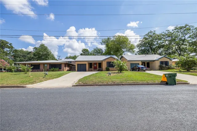 an aerial view of residential house with outdoor space