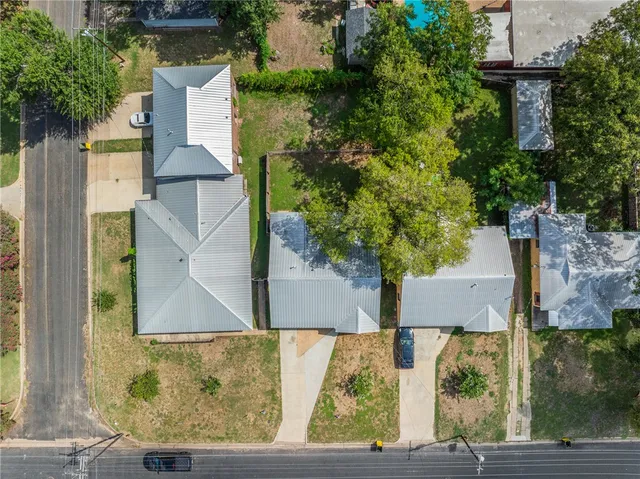 an aerial view of house with yard swimming pool and outdoor seating