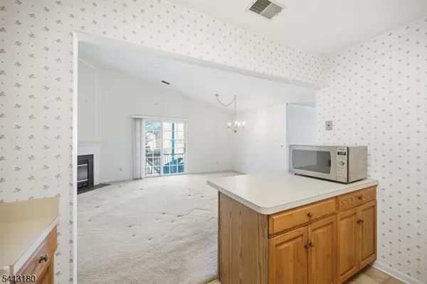a view of granite countertop cabinets sink and dishwasher