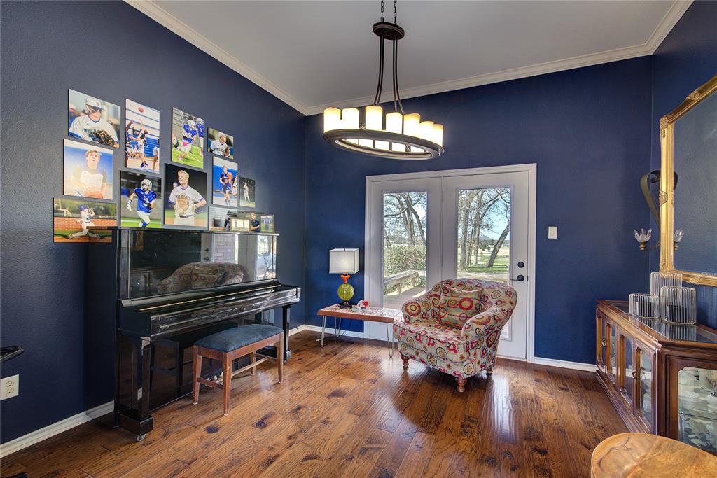 1079 Country Club Road Sulphur Springs, TX 75482 - Photo 15 of 40 a living room with furniture and a chandelier