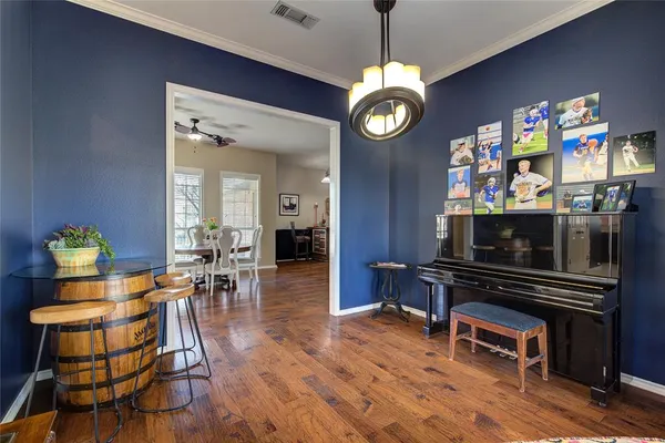 a view of a dining room with furniture and wooden floor