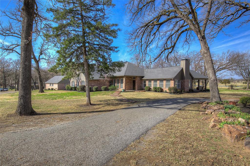 1079 Country Club Road Sulphur Springs, TX 75482 - Photo 2 of 40 a view of street with large trees