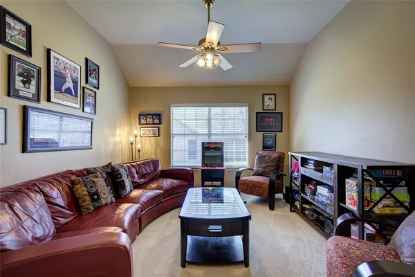 a living room with furniture and a window