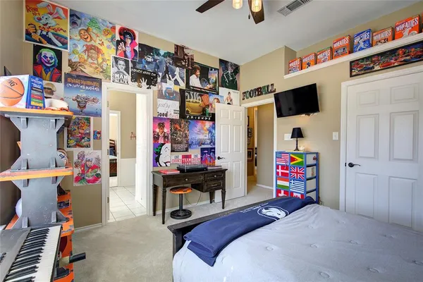 a bedroom with a bed a storage and utility room