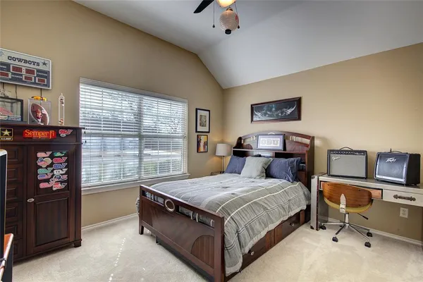 a bed room with a bed and a tv
