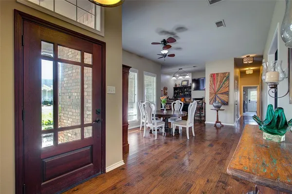 a view of a dining room with furniture window and wooden floor
