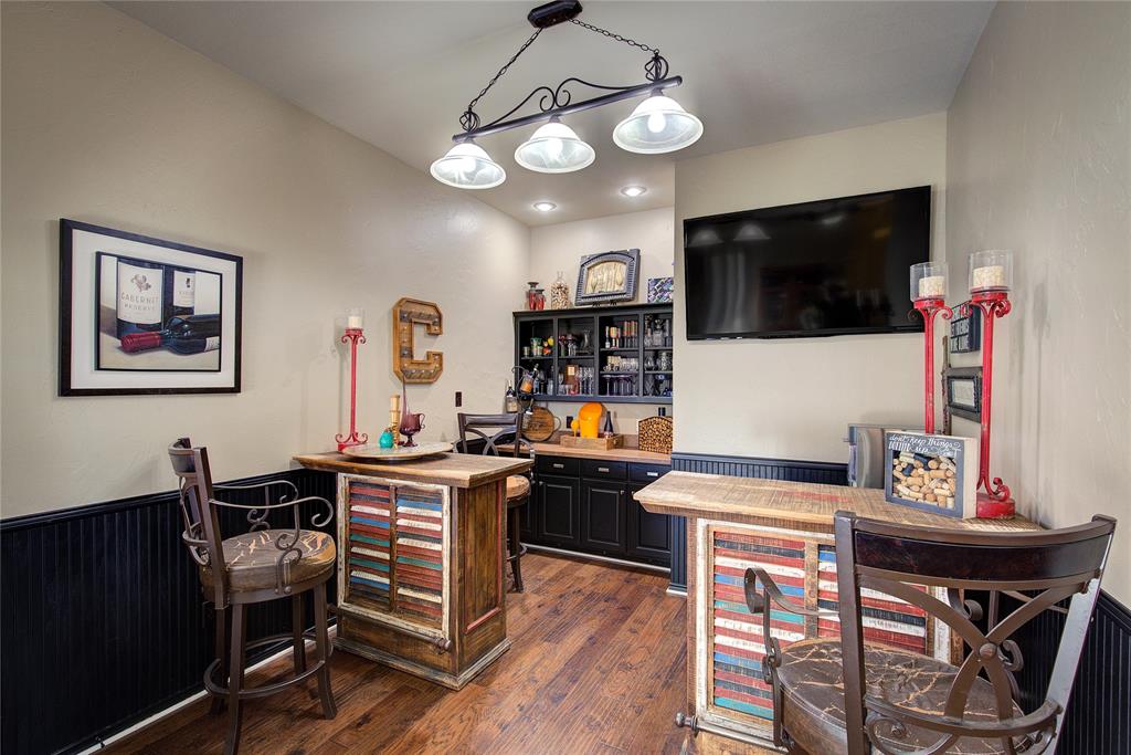 1079 Country Club Road Sulphur Springs, TX 75482 - Photo 8 of 40 a view of a dining room with furniture wooden floor and a chandelier