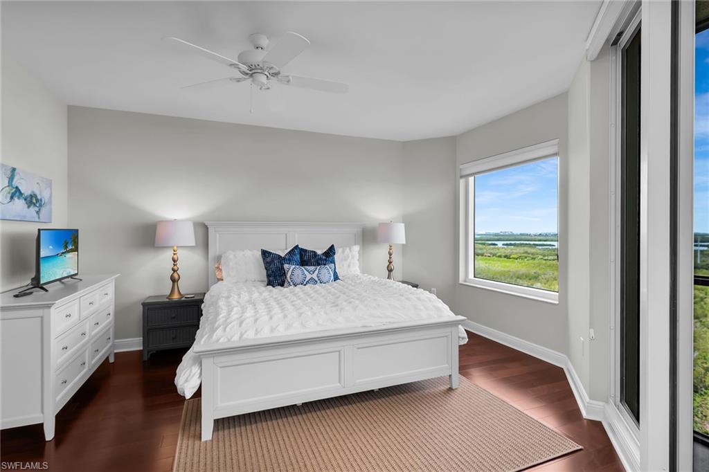 1065 Borghese Lane, Unit 1003 Naples, FL 34114 - Photo 13 of 35 a bedroom with a bed and a window