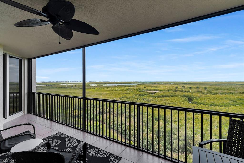 1065 Borghese Lane, Unit 1003 Naples, FL 34114 - Photo 28 of 35 a view of balcony with furniture