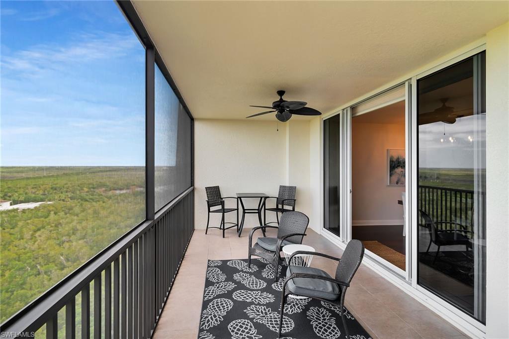 1065 Borghese Lane, Unit 1003 Naples, FL 34114 - Photo 29 of 35 a view of a balcony with furniture