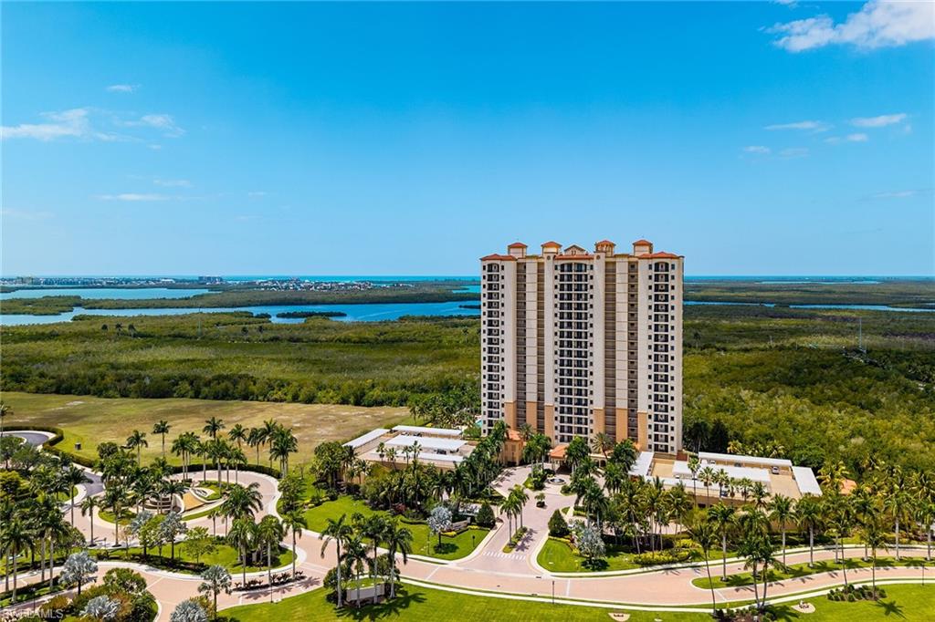1065 Borghese Lane, Unit 1003 Naples, FL 34114 - Photo 32 of 35 a view of a city with tall buildings