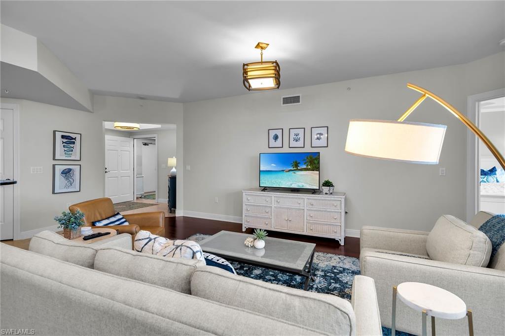 1065 Borghese Lane, Unit 1003 Naples, FL 34114 - Photo 10 of 35 a living room with furniture and a couch