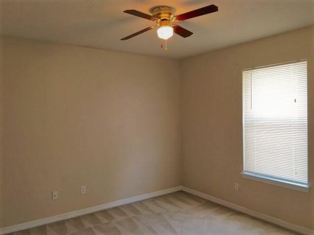 134 Sandstone Trail Crestview, FL 32539 - Photo 14 of 18 an empty room with a window and a fan