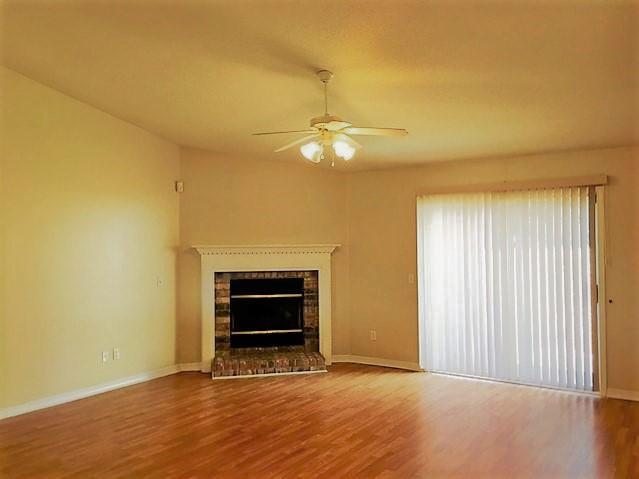 134 Sandstone Trail Crestview, FL 32539 - Photo 2 of 18 an empty room with a fireplace and a window