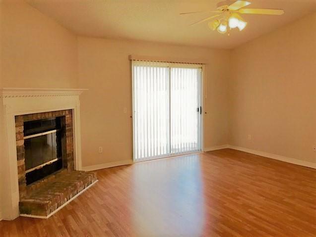134 Sandstone Trail Crestview, FL 32539 - Photo 3 of 18 an empty room with wooden floor and windows