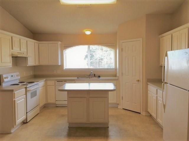 134 Sandstone Trail Crestview, FL 32539 - Photo 4 of 18 a kitchen with a sink stove and refrigerator