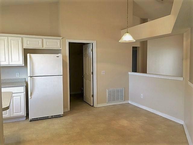 134 Sandstone Trail Crestview, FL 32539 - Photo 6 of 18 a view of a kitchen with a refrigerator and a refrigerator