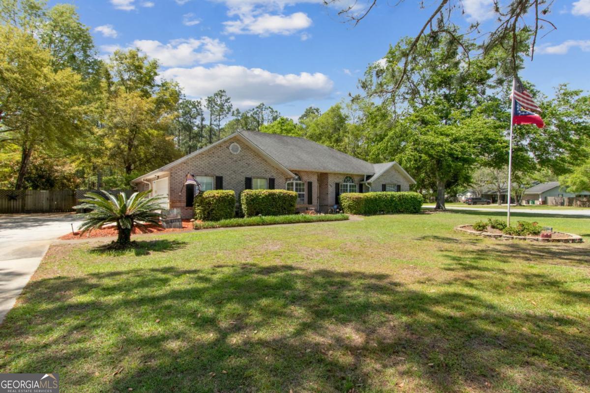 100 Longwood Road St. Marys, GA 31558 - Photo 2 of 39 a front view of house with yard and green space