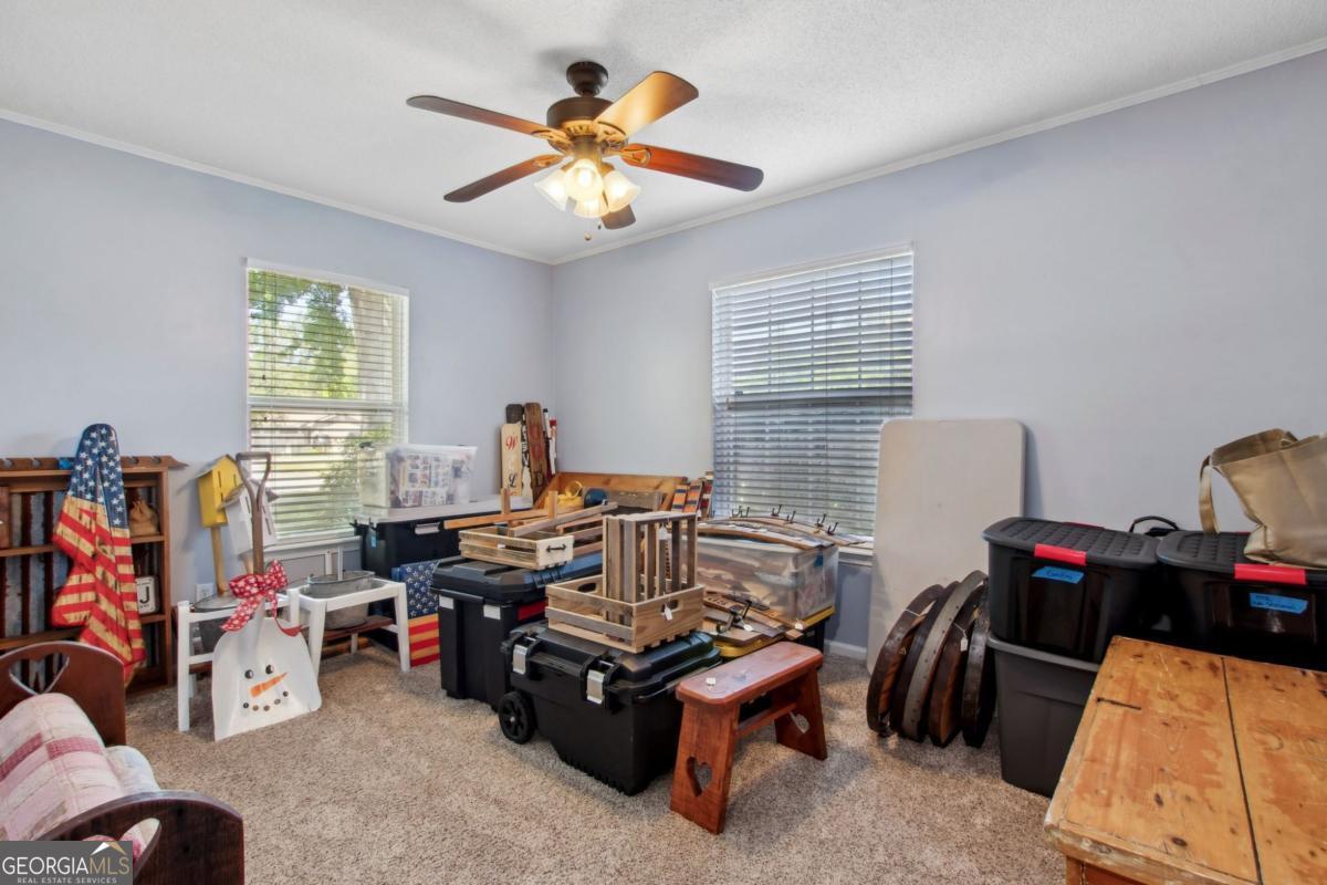 100 Longwood Road St. Marys, GA 31558 - Photo 21 of 39 a view of a workspace with furniture and a window