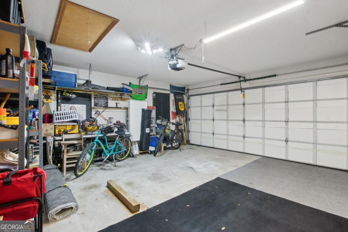 100 Longwood Road St. Marys, GA 31558 - Photo 28 of 39 a view of a garage with a bike and storage