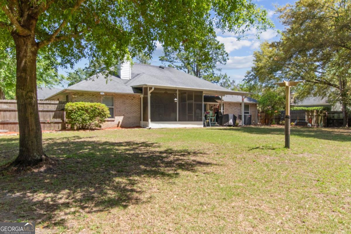 100 Longwood Road St. Marys, GA 31558 - Photo 32 of 39 a view of a house with a yard