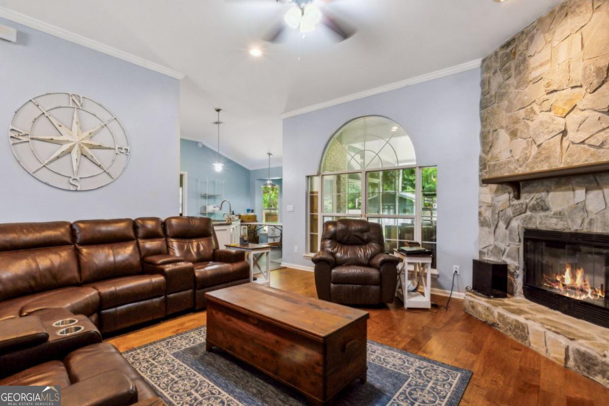 100 Longwood Road St. Marys, GA 31558 - Photo 5 of 39 a living room with furniture a large window and a fireplace