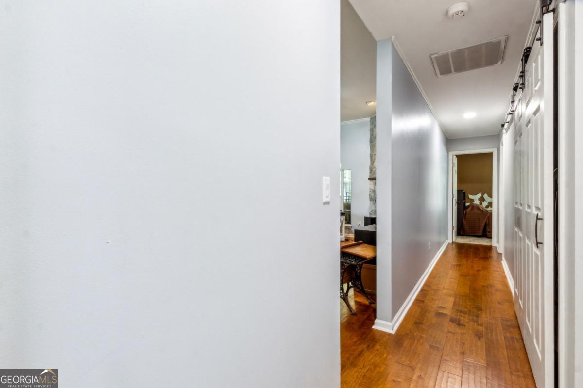 100 Longwood Road St. Marys, GA 31558 - Photo 7 of 39 a view of a hallway with wooden floor and staircase