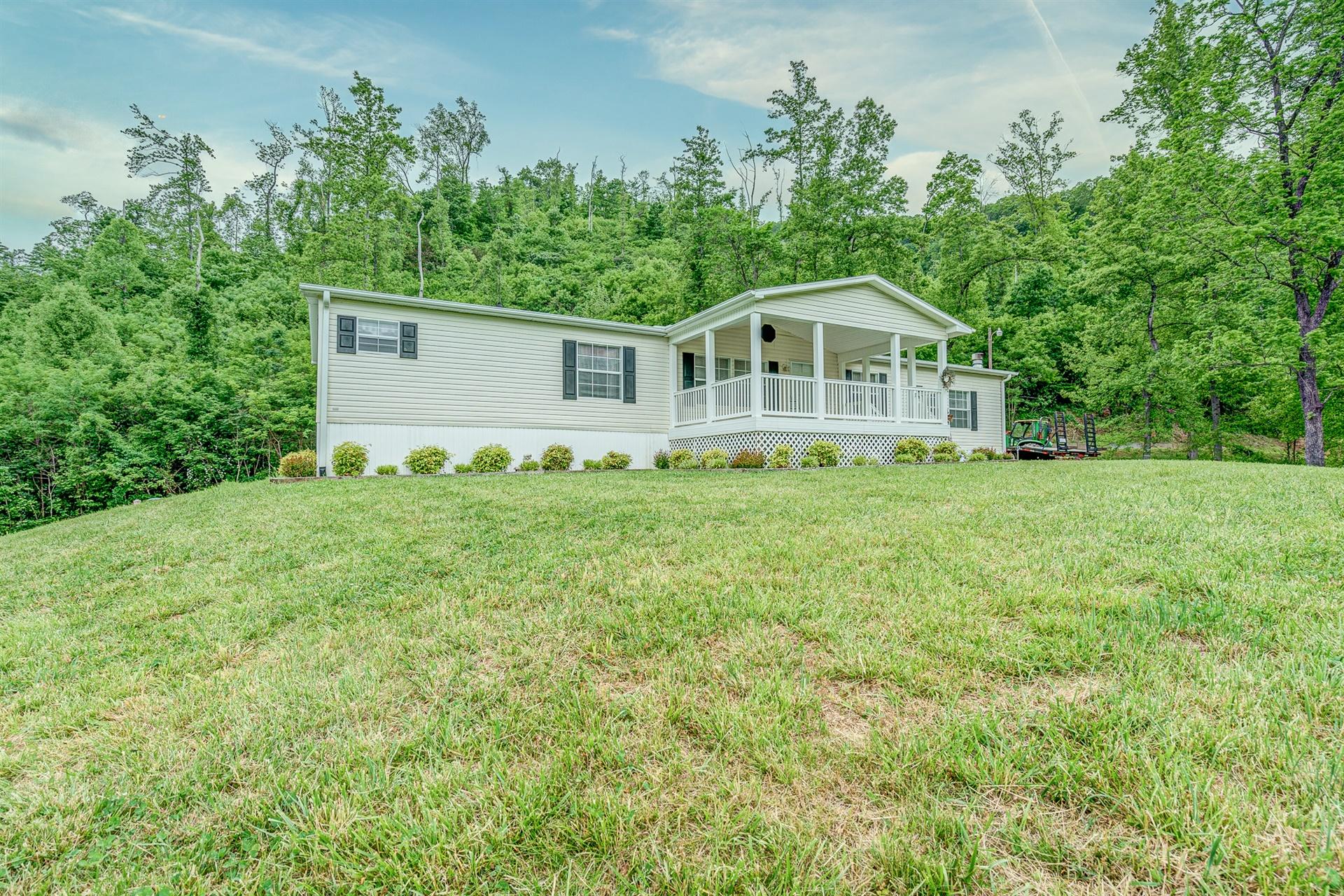 2930 Runnett Bag Road Ferrum, VA 24088 - Photo 3 of 42 a big white house with a big yard and large trees