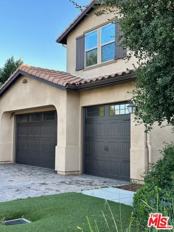 a house with trees in the background