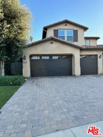 a front view of a house with a garage