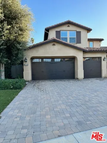 a front view of a house with a garage