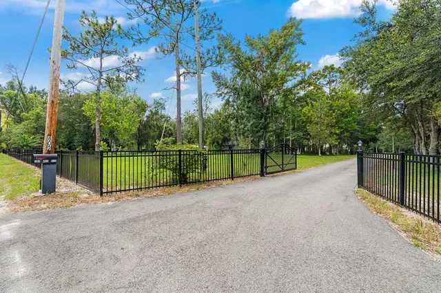 a backyard of a house with lots of green space