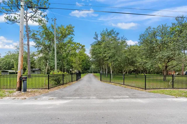 a front view of a house with swimming pool having outdoor seating