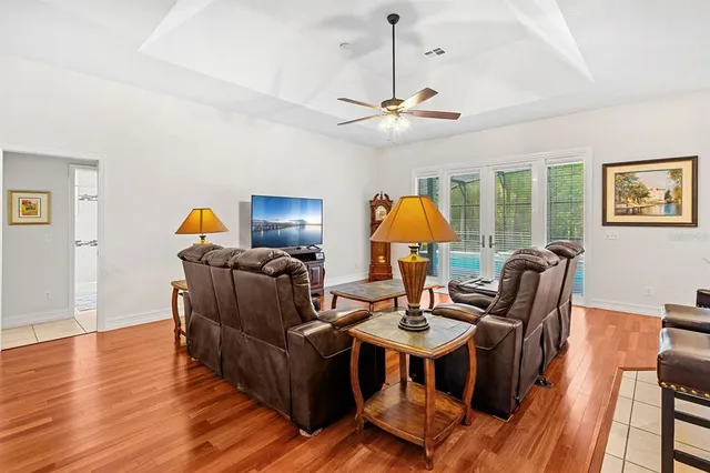 a view of a dining room with furniture and a large window