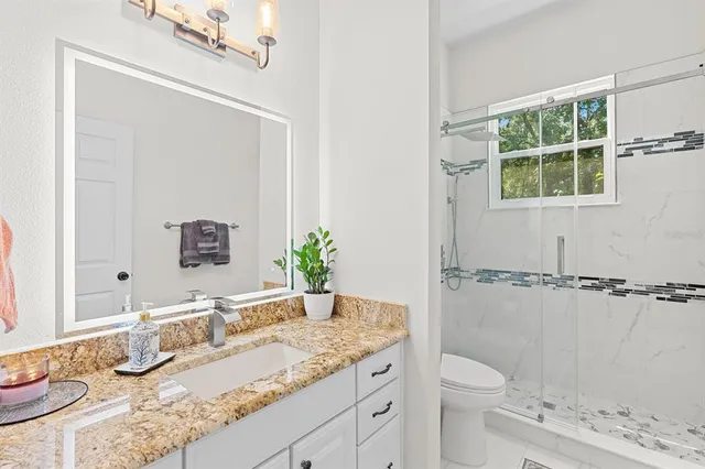 a white bath tub sitting next to a window