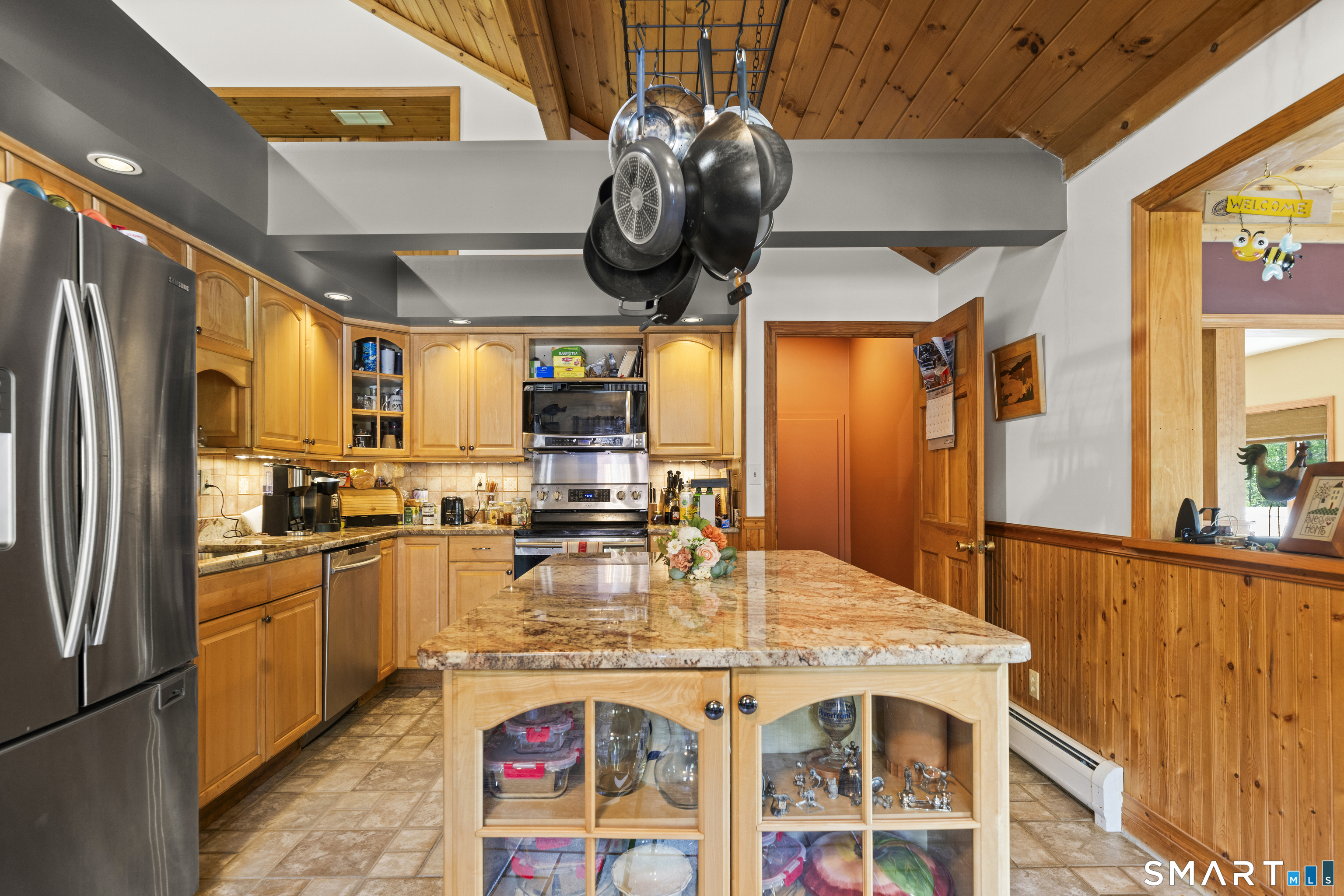 80 Holmes Road Goshen, CT 06756 - Photo 22 of 40 a kitchen with stainless steel appliances granite countertop a sink a stove and a refrigerator