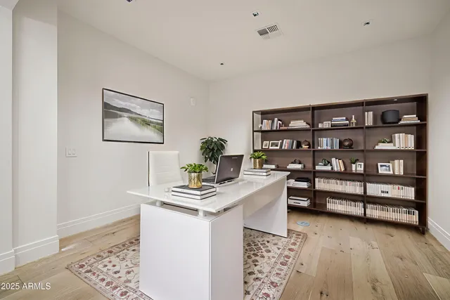 a workspace with furniture and window