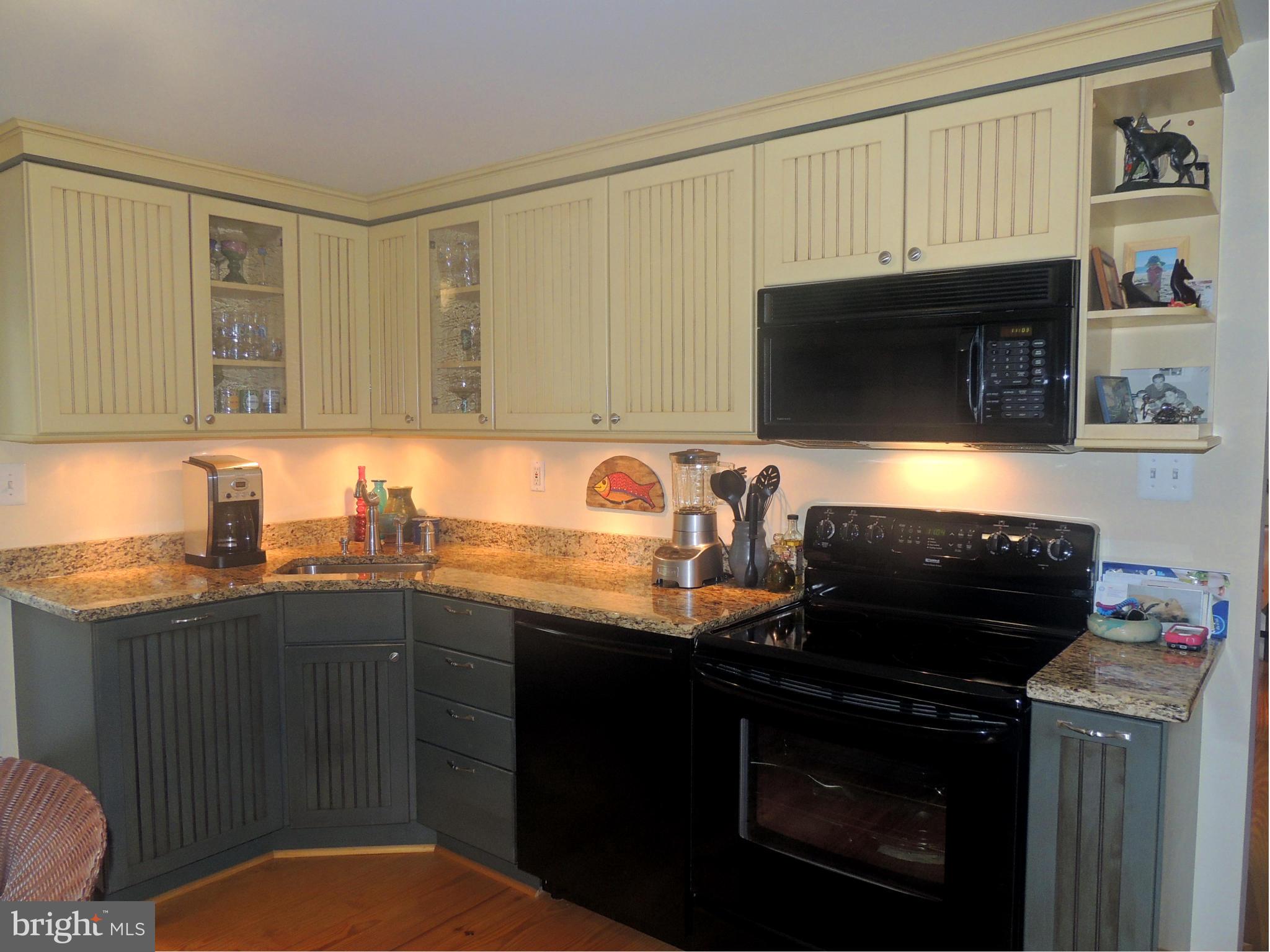 1316 Watervale Road Fallston, MD 21047 - Photo 9 of 30 a kitchen with granite countertop a sink dishwasher stove and cabinets