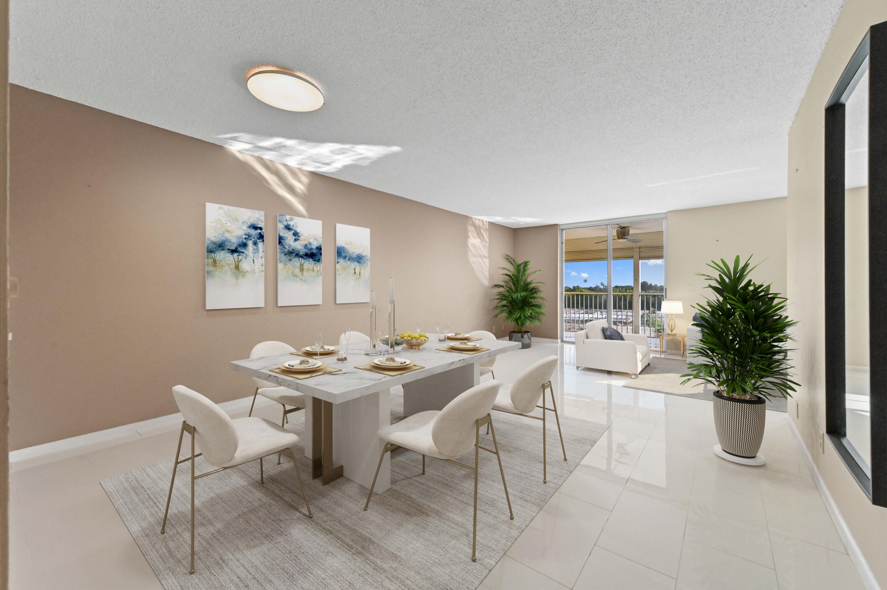 5700 Northwest 2nd Avenue, Unit 503 Boca Raton, FL 33487 - Photo 4 of 37 a view of a dining room with furniture and chandelier