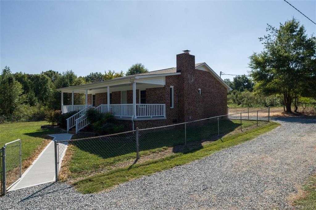 839 Sikes Mill Road Monroe, NC 28110 - Photo 3 of 26 a house view with a garden space