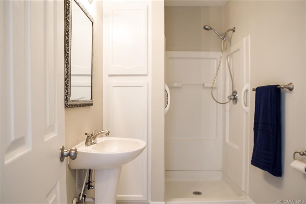 839 Sikes Mill Road Monroe, NC 28110 - Photo 22 of 26 a bathroom with a shower and a sink