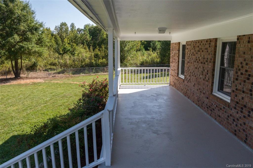839 Sikes Mill Road Monroe, NC 28110 - Photo 4 of 26 a view of a balcony with lake view