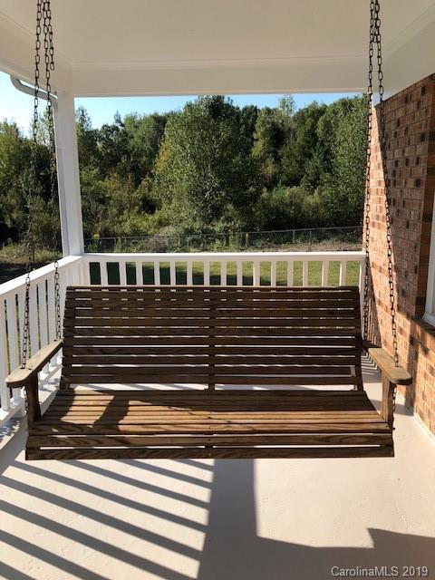 839 Sikes Mill Road Monroe, NC 28110 - Photo 5 of 26 a view of balcony with wooden floor
