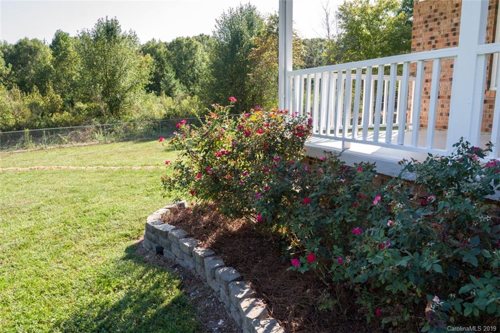 839 Sikes Mill Road Monroe, NC 28110 - Photo 7 of 26 a view of a garden with statue